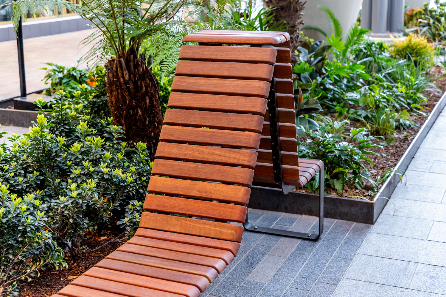 Tailored Linea VT seating system with Spotted Gum hardwood battens, Textura Dark Bronze frame.