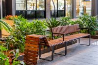 Tailored Linea VT seating system with Spotted Gum hardwood battens, Textura Dark Bronze frame.