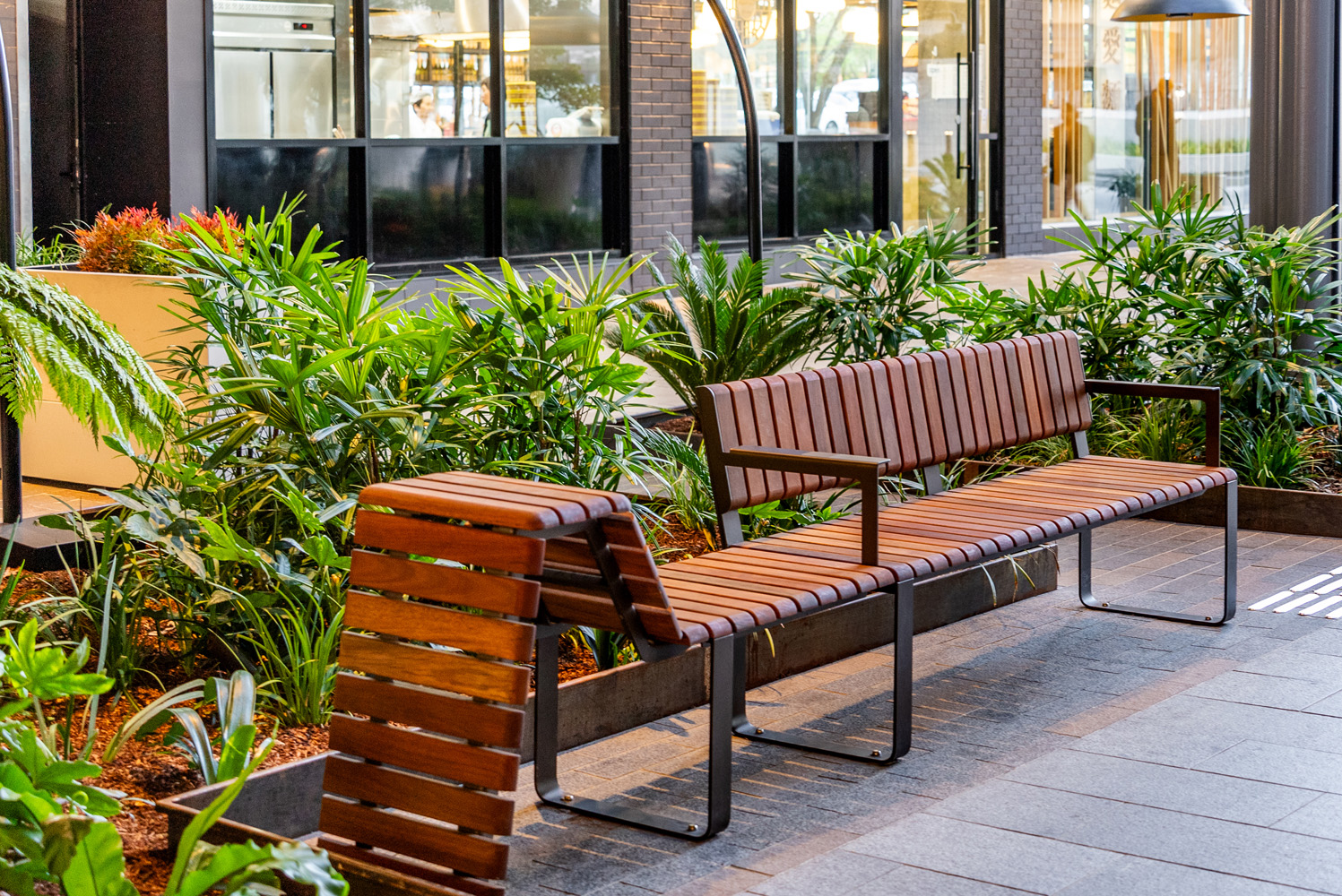 Tailored Linea VT seating system with Spotted Gum hardwood battens, Textura Dark Bronze frame.