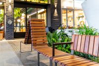 Tailored Linea VT seating system with Spotted Gum hardwood battens, Textura Dark Bronze frame.