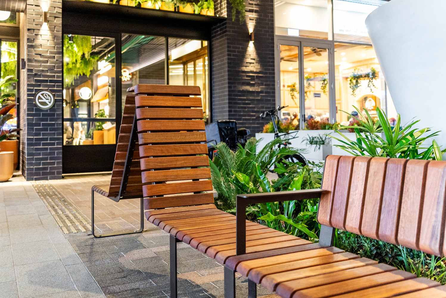 Tailored Linea VT seating system with Spotted Gum hardwood battens, Textura Dark Bronze frame.
