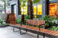 Tailored Linea VT seating system with Spotted Gum hardwood battens, Textura Dark Bronze frame.