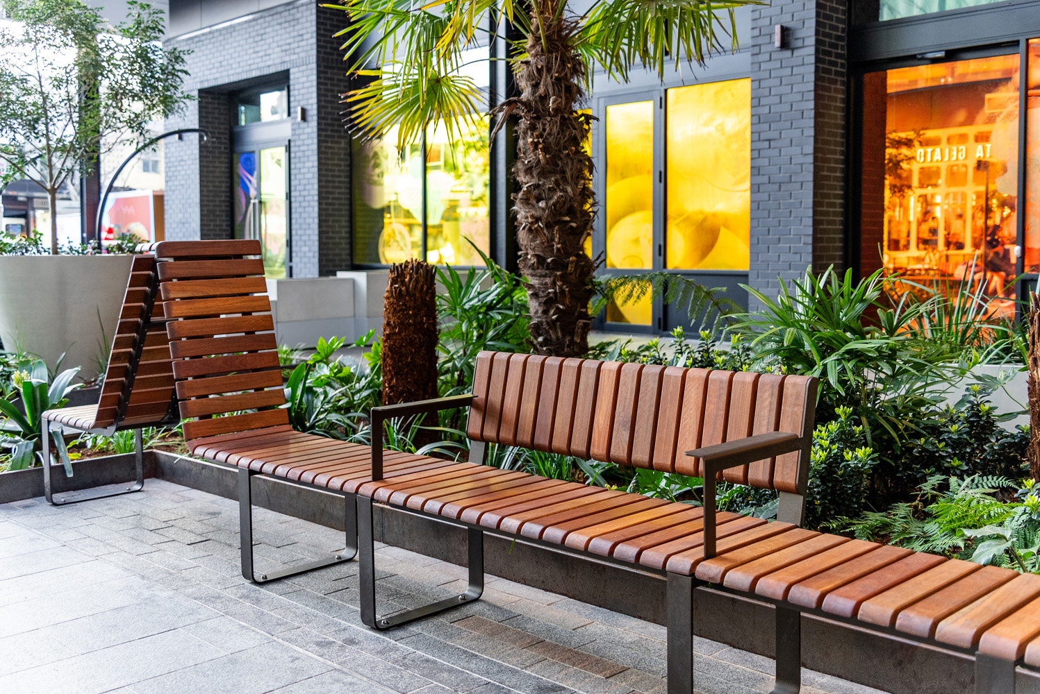 Tailored Linea VT seating system with Spotted Gum hardwood battens, Textura Dark Bronze frame.