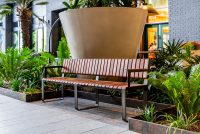 Tailored Linea VT seating system with Spotted Gum hardwood battens, Textura Dark Bronze frame.