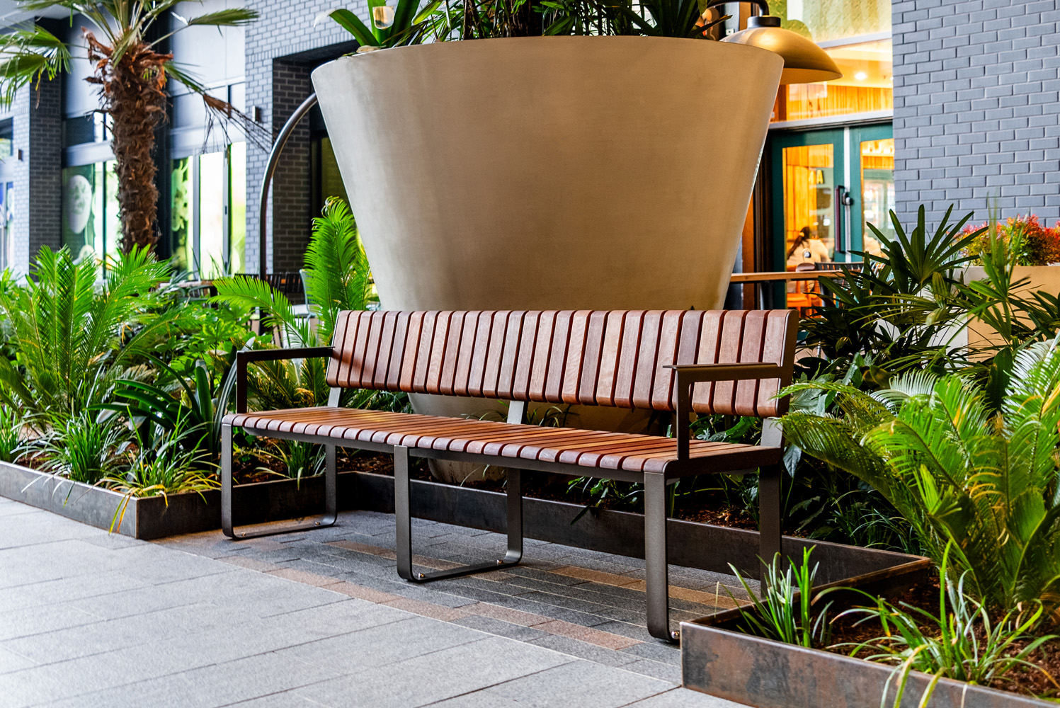 Tailored Linea VT seating system with Spotted Gum hardwood battens, Textura Dark Bronze frame.