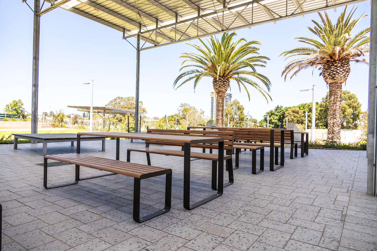 Linea Table (LIT10, 2100mm with LIS10 and LIB6, 1800mm) in aluminium Spotted Gum, Textura Dark Bronze.