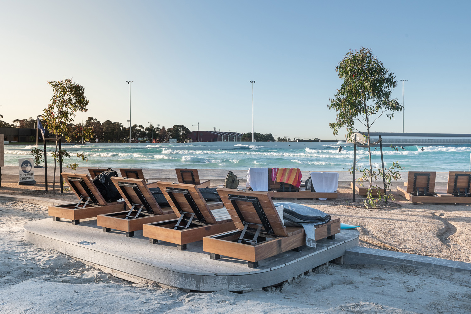 Custom double and single sun loungers, and side tables, for URBNSURF Melbourne.