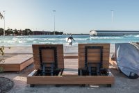Custom double and single sun loungers, and side tables, for URBNSURF Melbourne.