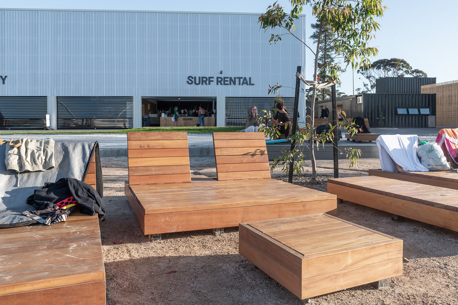 Custom double and single sun loungers, and side tables, for URBNSURF Melbourne.