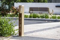 Linea Bollard (B6) with etched artwork, aluminium Bush Cherry insert, Textura Doe Skin frame.