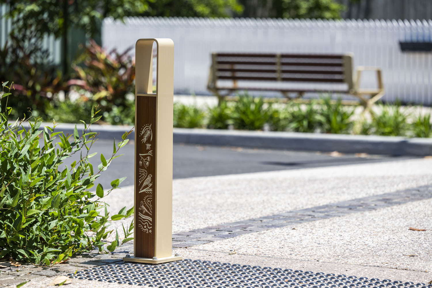 Linea Bollard (B6) with etched artwork, aluminium Bush Cherry insert, Textura Doe Skin frame.