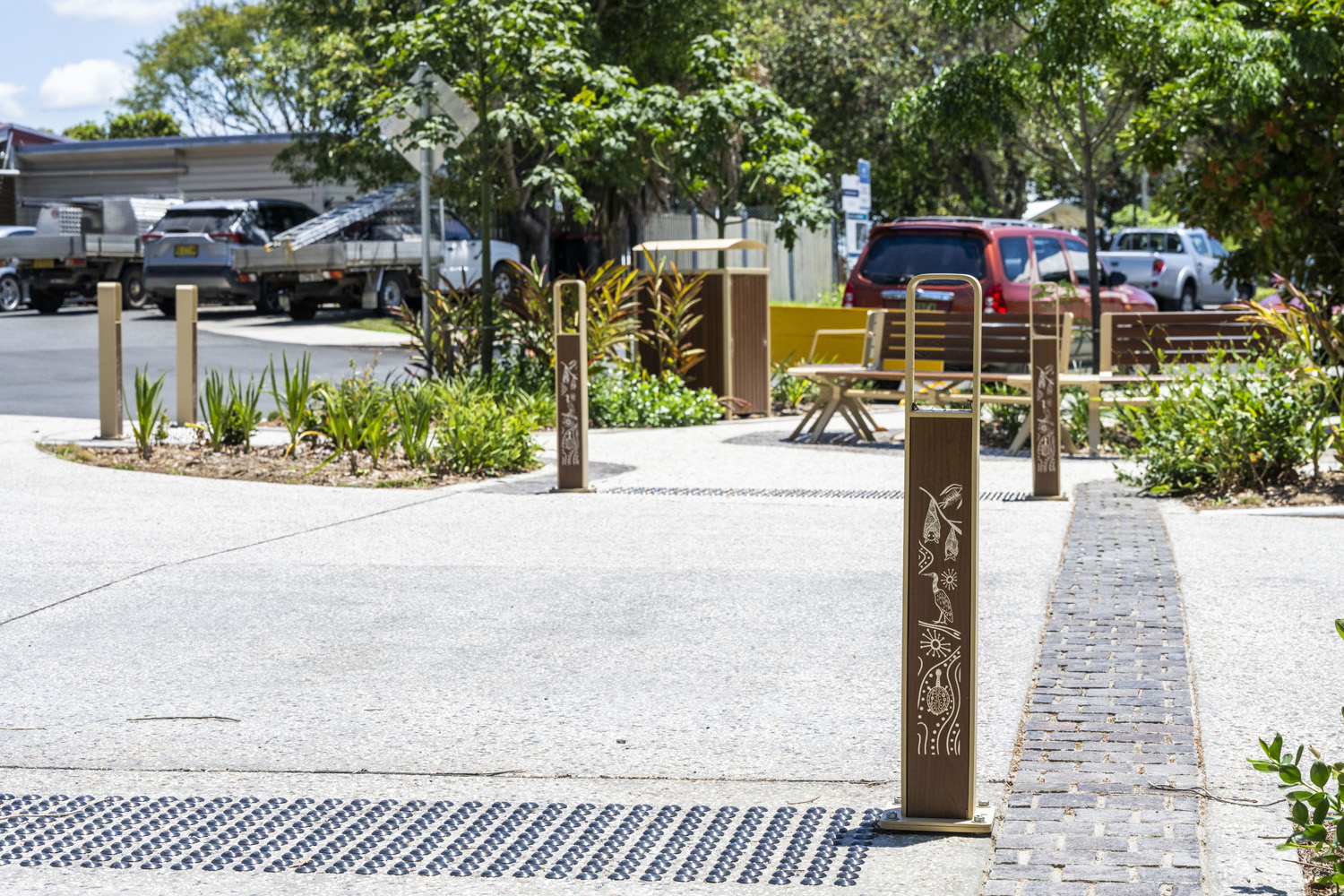 Linea Bollard (B6) with etched artwork, aluminium Bush Cherry insert, Textura Doe Skin frame.