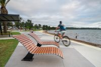 Mall Sun Lounge, with woodgrain aluminium battens in Bush Cherry, frames in Night Sky.