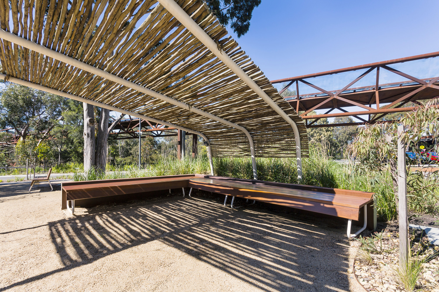Custom benches, designed by SBLA, with hardwood battens and custom Shoji White frame.