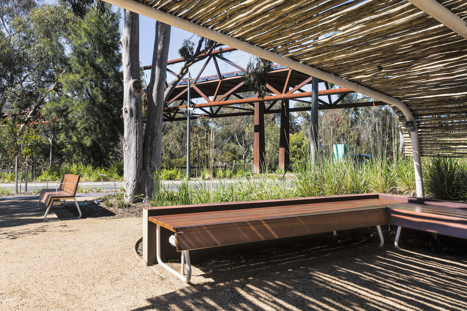 Custom bench and seat, designed by SBLA, with hardwood battens and custom Shoji White frame.