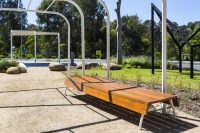 Custom bench, designed by SBLA, with hardwood battens and custom Shoji White frame.