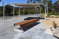 Custom bench, designed by SBLA, with hardwood battens and custom Shoji White frame.
