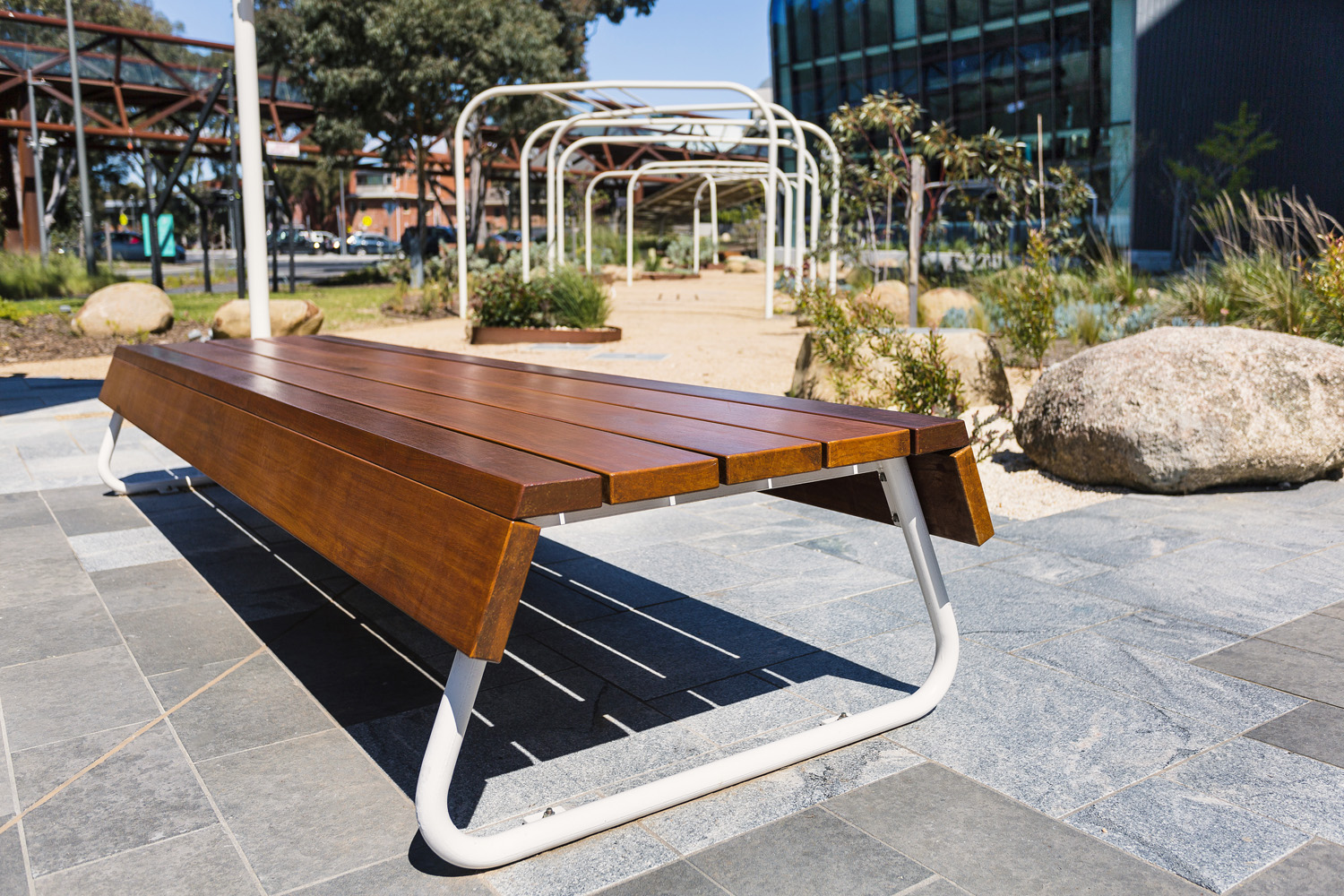 Custom bench, designed by SBLA, with hardwood battens and custom Shoji White frame.