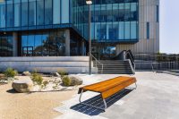 Custom bench, designed by SBLA, with hardwood battens and custom Shoji White frame.