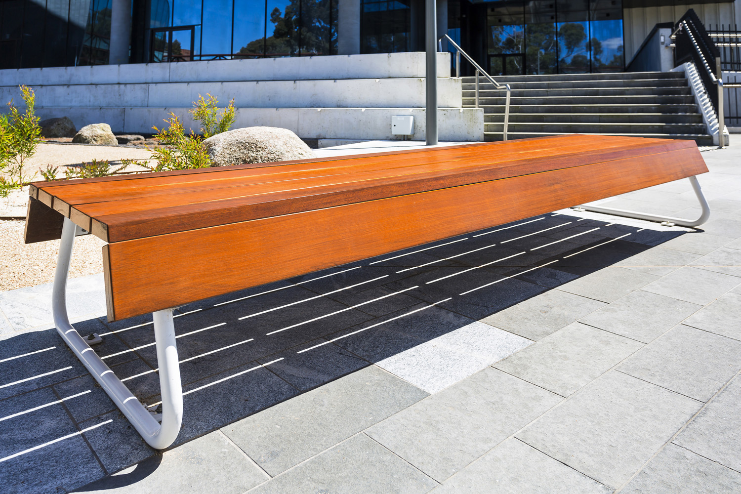 Custom bench, designed by SBLA, with hardwood battens and custom Shoji White frame.