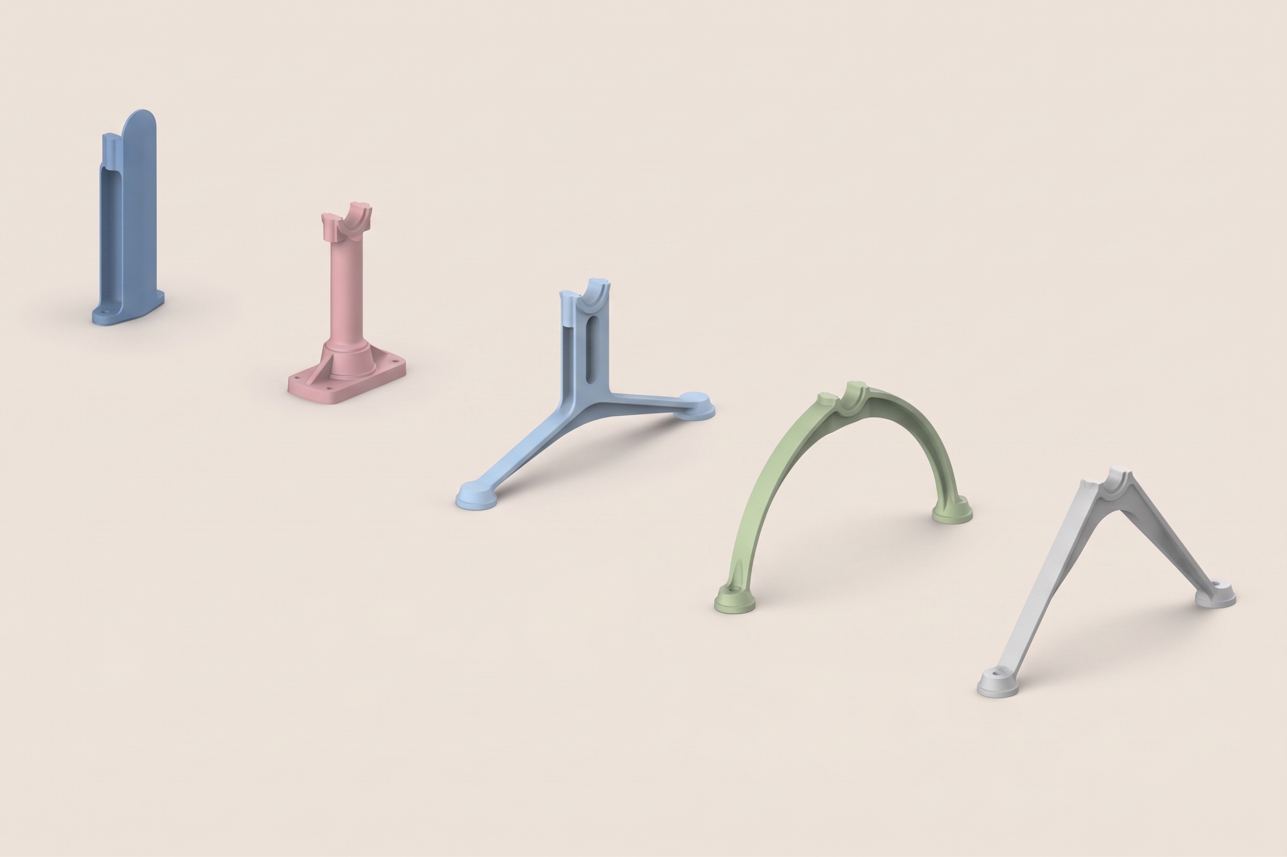 Group of pastel-colored, abstract stand frames arranged on a light beige surface, spaced apart.