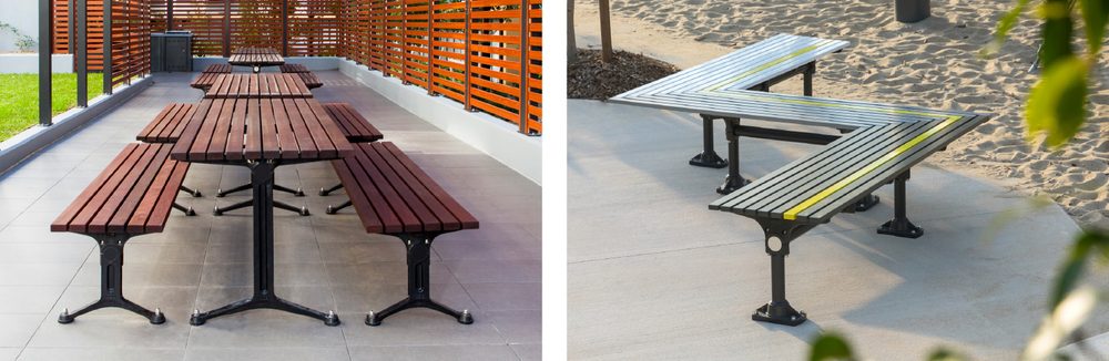 Tee Leg_Post Leg_Street Furniture Australia - Street Furniture Australia Two outdoor seating areas: left a long wooden picnic table with attached benches on a tiled patio beside an orange wooden fence; right gray metal benches with yellow stripes on a concrete area near sand.